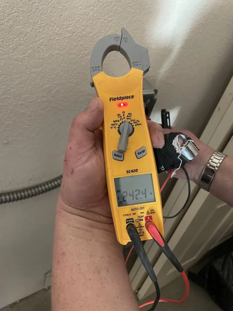 Voltage testing with clamp meter during Recessed Lighting Installation in Dawsonville